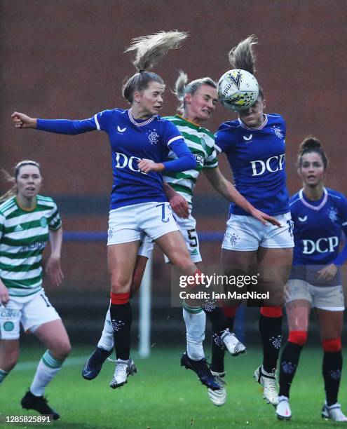 Brogan Hay and Chelsea Anna Cornet of Rangers jump with Natalie Ross of Celtic during the Scottish Building Society Women's Premier League match...