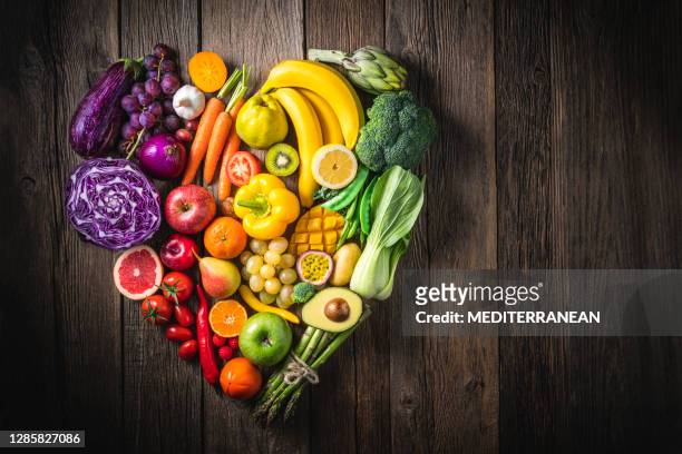 vegetables and fruit with heart shape as concept of cardiovascular health - vegetable stock pictures, royalty-free photos & images