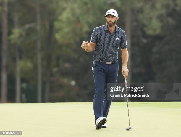 Dustin Johnson of the United States celebrates on the 18th green after winning the Masters at Augusta National Golf Club on November 15, 2020 in...