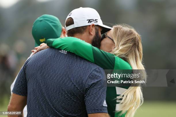 Dustin Johnson of the United States kisses fiancée Paulina Gretzky after winning the Masters at Augusta National Golf Club on November 15, 2020 in...