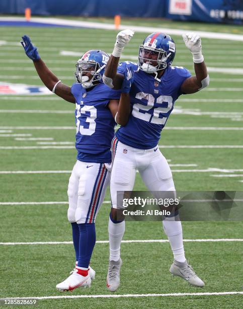 Wayne Gallman celebrates a touchdown with Dion Lewis during the second half against the Philadelphia Eagles at MetLife Stadium on November 15, 2020...