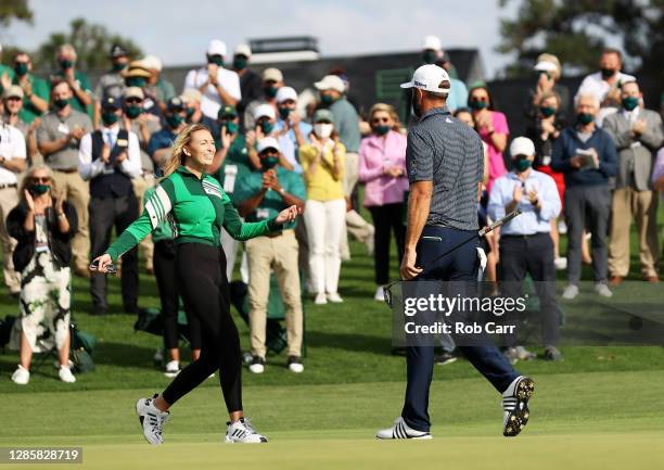 Dustin Johnson of the United States celebrates with fiancée Paulina Gretzky after winning the Masters at Augusta National Golf Club on November 15,...
