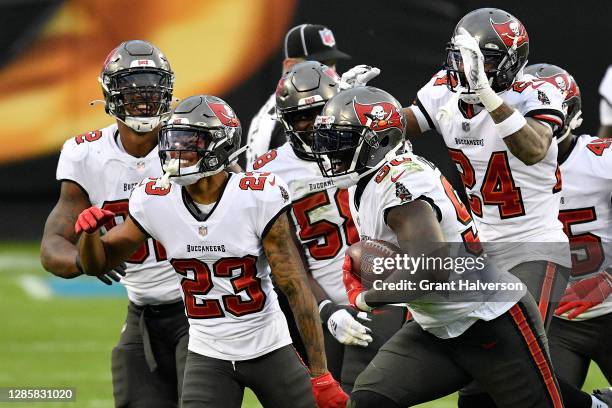 Jason Pierre-Paul of the Tampa Bay Buccaneers celebrates with his teammates after an interception of Teddy Bridgewater of the Carolina Panthers...