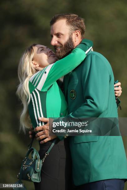 Dustin Johnson of the United States celebrates with fiancée Paulina Gretzky during the Green Jacket Ceremony after winning the Masters at Augusta...