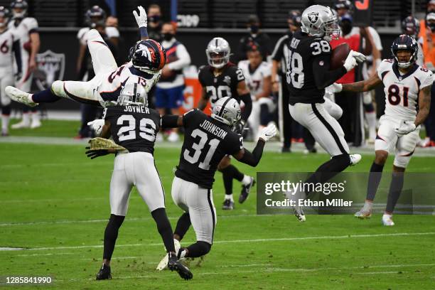 Jeff Heath of the Las Vegas Raiders intercepts a pass intended for K.J. Hamler of the Denver Broncos during the first quarter at Allegiant Stadium on...