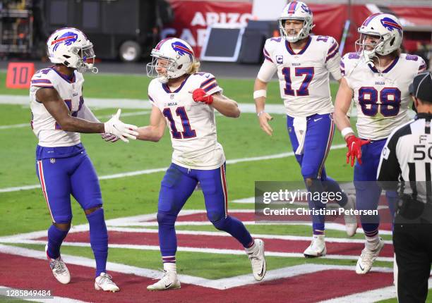 Wide receiver Cole Beasley of the Buffalo Bills celebrates with wide receiver Stefon Diggs after Beasley's touchdown during the second half against...