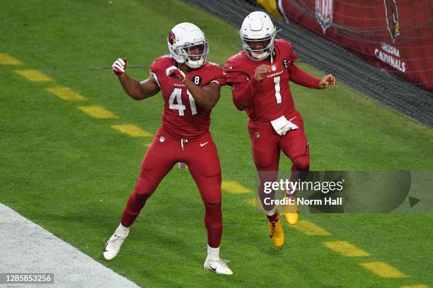 Running back Kenyan Drake of the Arizona Cardinals celebrates with quarterback Kyler Murray after Murray's touchdown during the second half against...