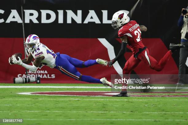Wide receiver Stefon Diggs of the Buffalo Bills catches a touchdown pass to take the lead as cornerback Patrick Peterson of the Arizona Cardinals...