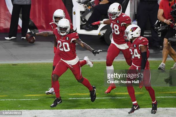 Cornerback Dre Kirkpatrick of the Arizona Cardinals reacts with linebacker Isaiah Simmons and safety Jalen Thompson after the Cardinals score a...
