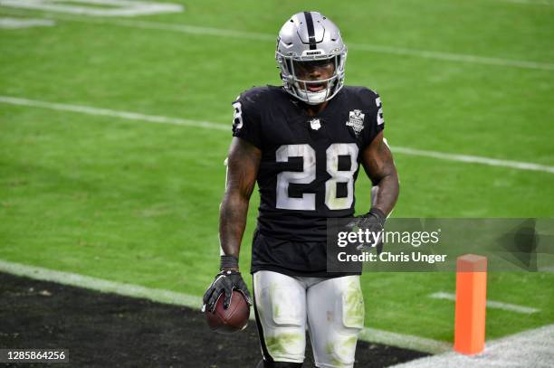 Running back Josh Jacobs of the Las Vegas Raiders runs for a 5-yard touchdown against the Denver Broncos in the second half of their game at...