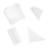 Set of white folded napkins square rectangular triangular isolated on white background