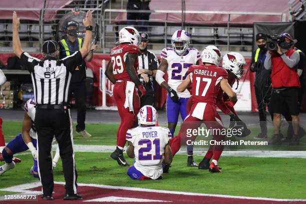 Wide receiver DeAndre Hopkins of the Arizona Cardinals is congratulated by Andy Isabella and Chase Edmonds after catching the game winning 43-yard...