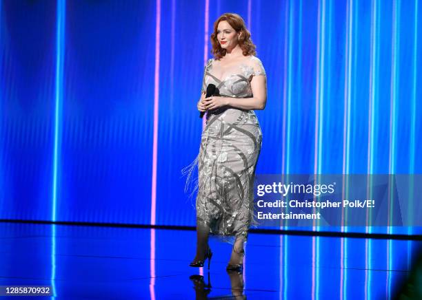 In this image released on November 15, Christina Hendricks speaks onstage for the 2020 E! People's Choice Awards held at the Barker Hangar in Santa...