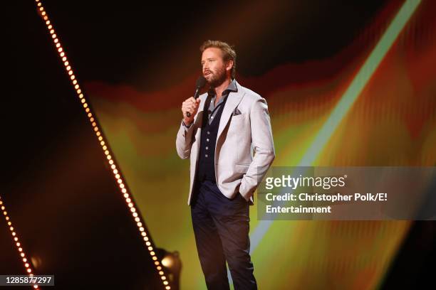 In this image released on November 15, Armie Hammer speaks onstage for the 2020 E! People's Choice Awards held at the Barker Hangar in Santa Monica,...