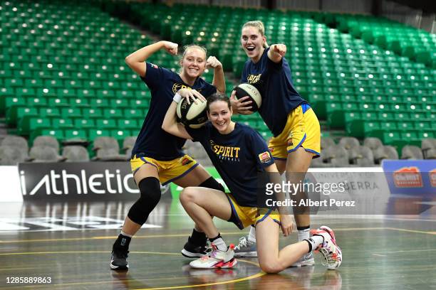 Bendigo Spirit players Piper Dunlop, Alicia Froling and Jennie Rintala pose during the round two WNBL match between the UC Capitals and the Bendigo...