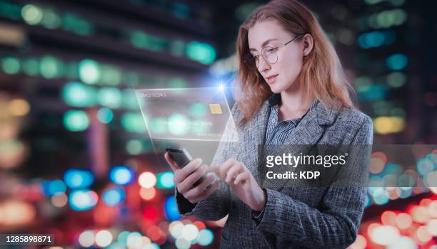 business woman using phone for online shopping and paying money on credit electronic banking, business mobile banking and global finance concept. - digital payment stock-fotos und bilder