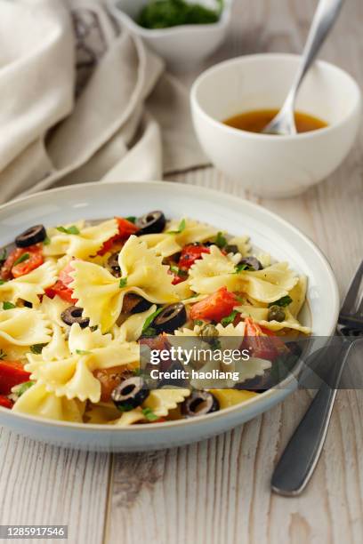 healthy vegan farfalle pasta bowl - bow tie pasta stock pictures, royalty-free photos & images