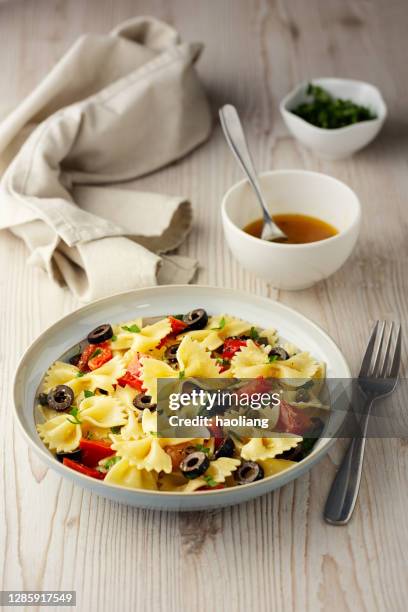 healthy vegan farfalle pasta bowl - bow tie pasta salad stock pictures, royalty-free photos & images