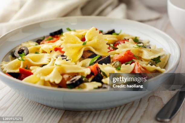healthy vegan farfalle pasta bowl - bow tie pasta salad stock pictures, royalty-free photos & images