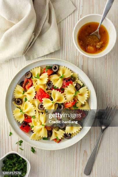 healthy vegan farfalle pasta bowl - bow tie pasta salad stock pictures, royalty-free photos & images