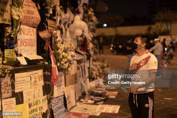 Man stands next to a memorial for the murdered during the massive protests next to National Congress on November 15, 2020 in Lima, Peru. Merino, who...