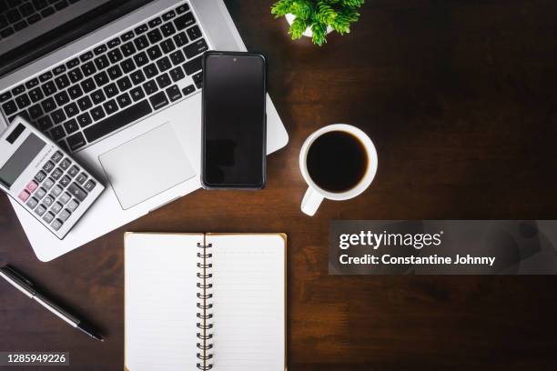 overhead shot of home office desk - calculator top view stock-fotos und bilder