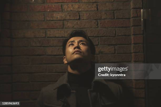 portrait of asian man at old street in japan - struggle stock pictures, royalty-free photos & images