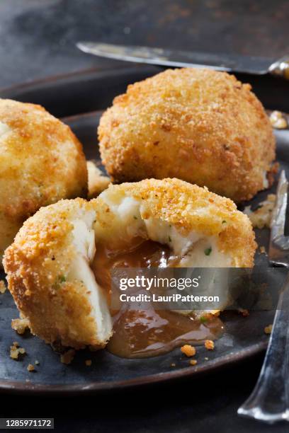 creamy mashed potato croquettes stuffed with gravy - stuffing stock pictures, royalty-free photos & images