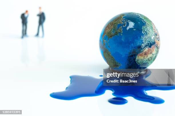 climate change and enviromental issues (painted marble) - earth ice melt stock pictures, royalty-free photos & images