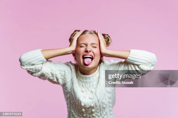 cute teenege girl shouting with raised hands - protruding stock pictures, royalty-free photos & images