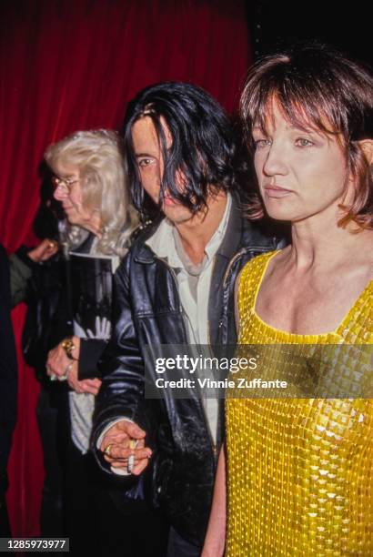 American actors Johnny Depp and Ellen Barkin attend the APLA Fashion Show Honors Isaac Mizrahi at the Mann's Chinese Theater in Los Angeles,...