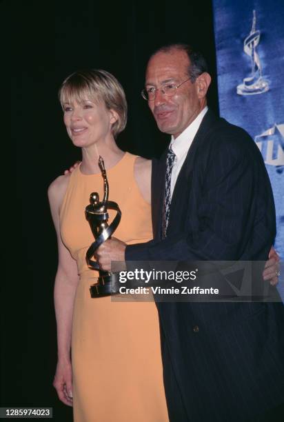 American actress Kim Basinger and Israeli film producer Arnon Milchan attend the 1997 ShoWest Awards, held at the MGM Grand Hotel in Las Vegas,...