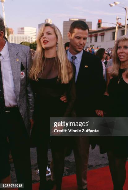American actress Kim Basinger and her brother, Mick Basinger attend the premiere of 'Batman', held at the Mann Village Theater in Los Angeles,...