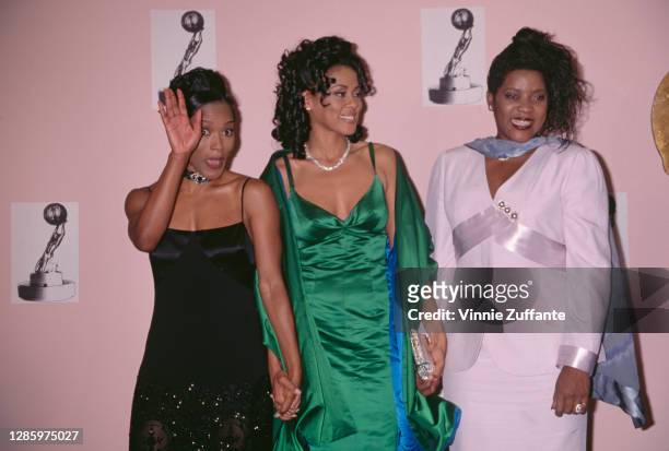 American actress Angela Bassett, American actress Lela Rochon, and American actress and singer Loretta Devine attend the 1996 NAACP Image Awards at...