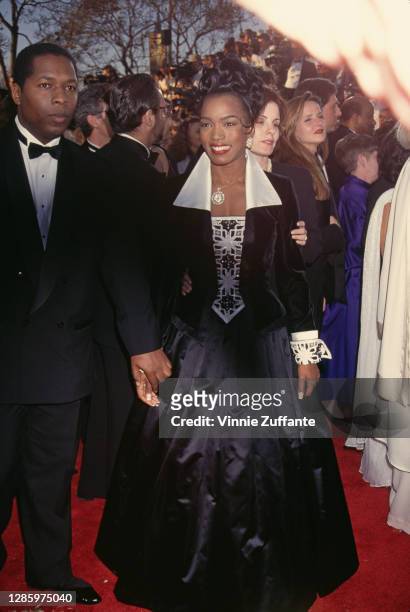 American actor Courtney B Vance and his wife, American actress Angela Bassett attend the 66th Annual Academy Awards, held at the Dorothy Chandler...