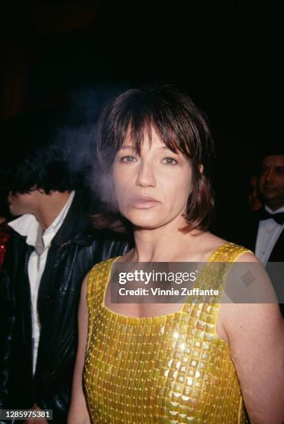 American actress Ellen Barkin exhales cigarette smoke as she attends the AIDS Project Los Angeles Fashion Show honouring Isaac Mizrahi, held at...