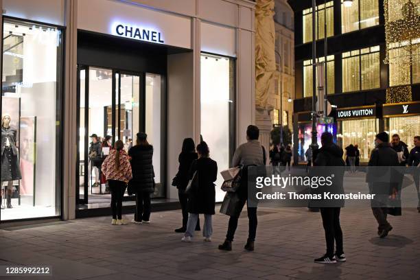 People line up at the Chanel store on the popular Graben pedestrian shopping zone the day before a strict nationwide lockdown is to go into effect on...