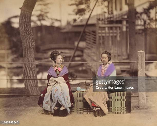 [Two Japanese Women Sitting on a Bench], 1870s. Artist Unknown.