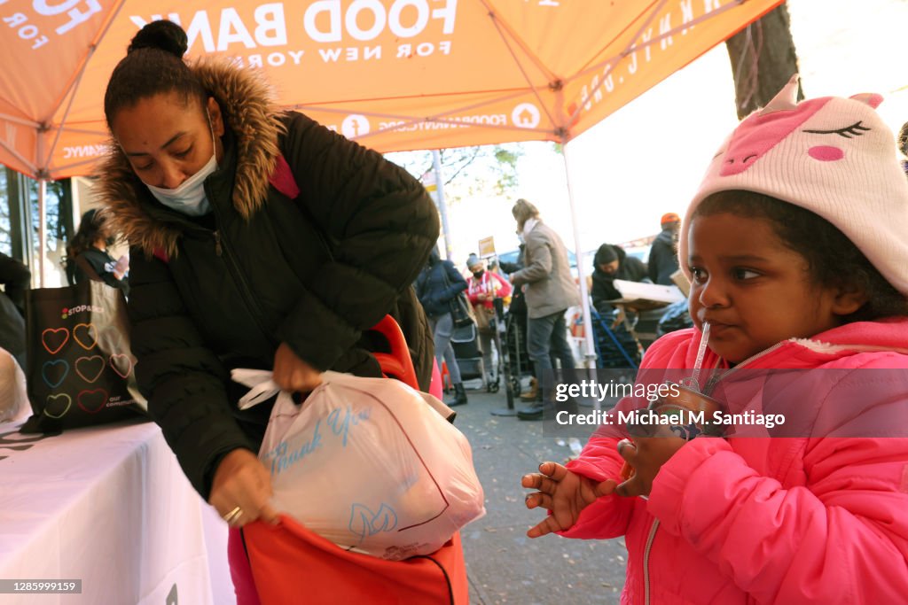 Harlem Food Bank Distributes Turkeys To Those In Need For Thanksgiving