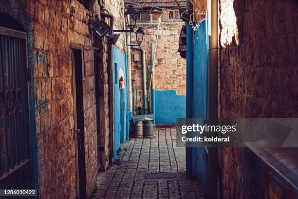 blue doors in narrow alley - safed stock pictures, royalty-free photos & images