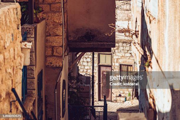 street in historic district at midday - safed stock pictures, royalty-free photos & images