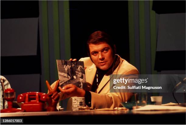 Stan Boorman had a popular TV/radio show. He is holding a photo I had captured at LA's First Love-In at Elysian Park. It shows a small black girl...