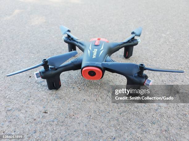 Close-up of a Syma drone on a concrete pathway in Central Park in San Ramon, California, USA, November 7, 2020.