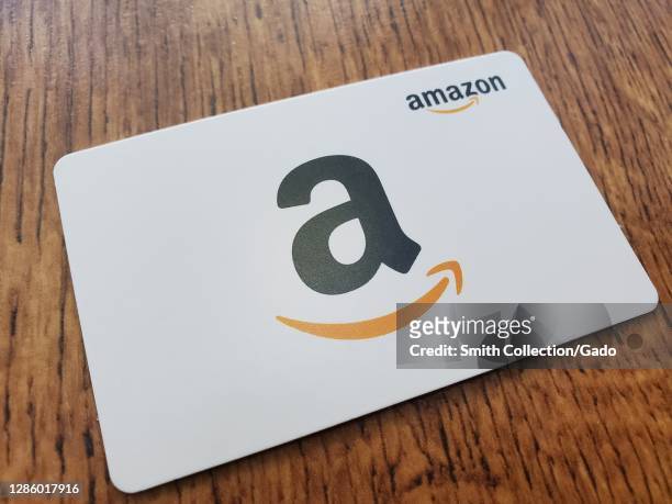 Close-up of a white Amazon gift card featuring the Amazon logo in San Ramon, California, USA, November 8, 2020.