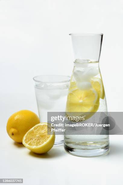 lemon water in carafe, lemons, germany - carafe stock pictures, royalty-free photos & images