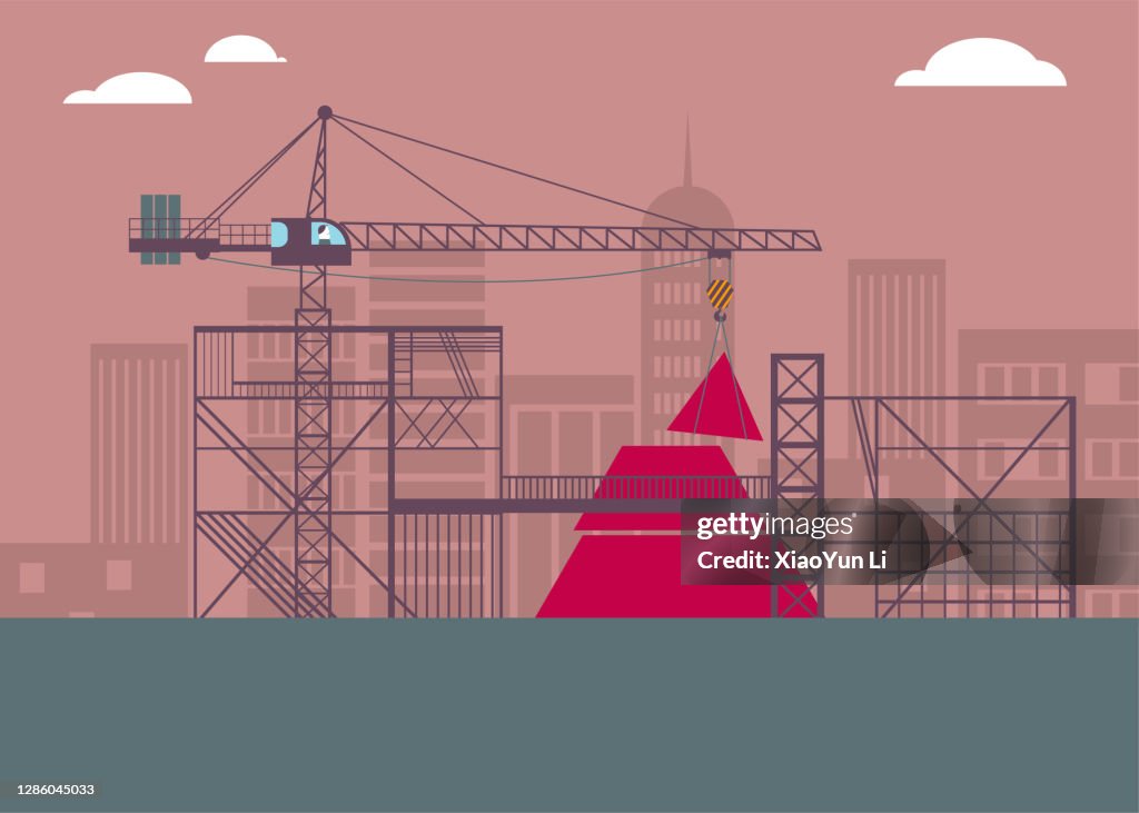 At the construction site, the pyramid is under construction.