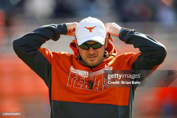 Head coach Tom Herman of the Texas Longhorns adjusts his whistle before a game against the Oklahoma State Cowboys at Boone Pickens Stadium on October...