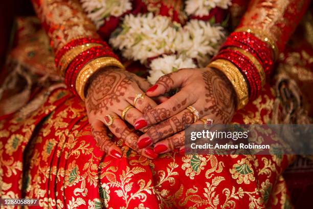 mahendi, henna tattoo on the hand of a bride with ornate bangles, traditional newari wedding, kathmandu, nepal - nepal women stock pictures, royalty-free photos & images