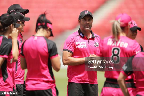 Sixers head coach Ben Sawyer speaks to players prior to the Women's Big Bash League WBBL match between the Sydney Sixers and the Brisbane Heat at...