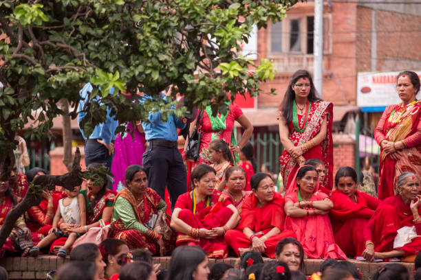 women watching celebrations at hindu teej festival pashupatinath temple, kathmandu, nepal - teej festival celebrated in nepal stock pictures, royalty-free photos & images